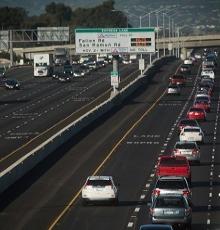 empty express land and crowded mainlanes of a freeway