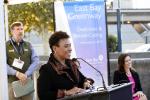 Woman speaking in front of podium