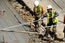 construction workers in hard hats and vests