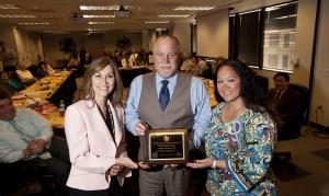 Alameda CTC Chair Supervisor Scott Haggerty presents the Golden Sneaker Award