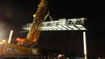 giant construction crane during nighttime