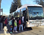 students line up in front of AC Transit Bus