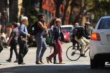 people walking across the street