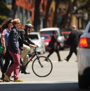 Pedestrians and bicyclist crossing street