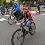 Students and parents biking to school